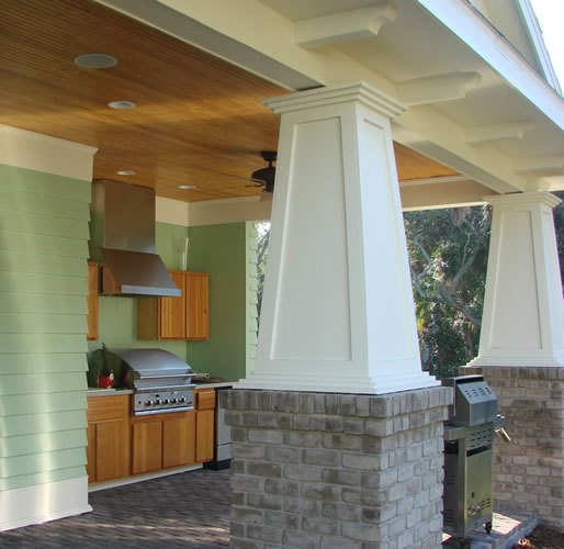Outdoor summer kitchen with cypress ceiling and masonry columns